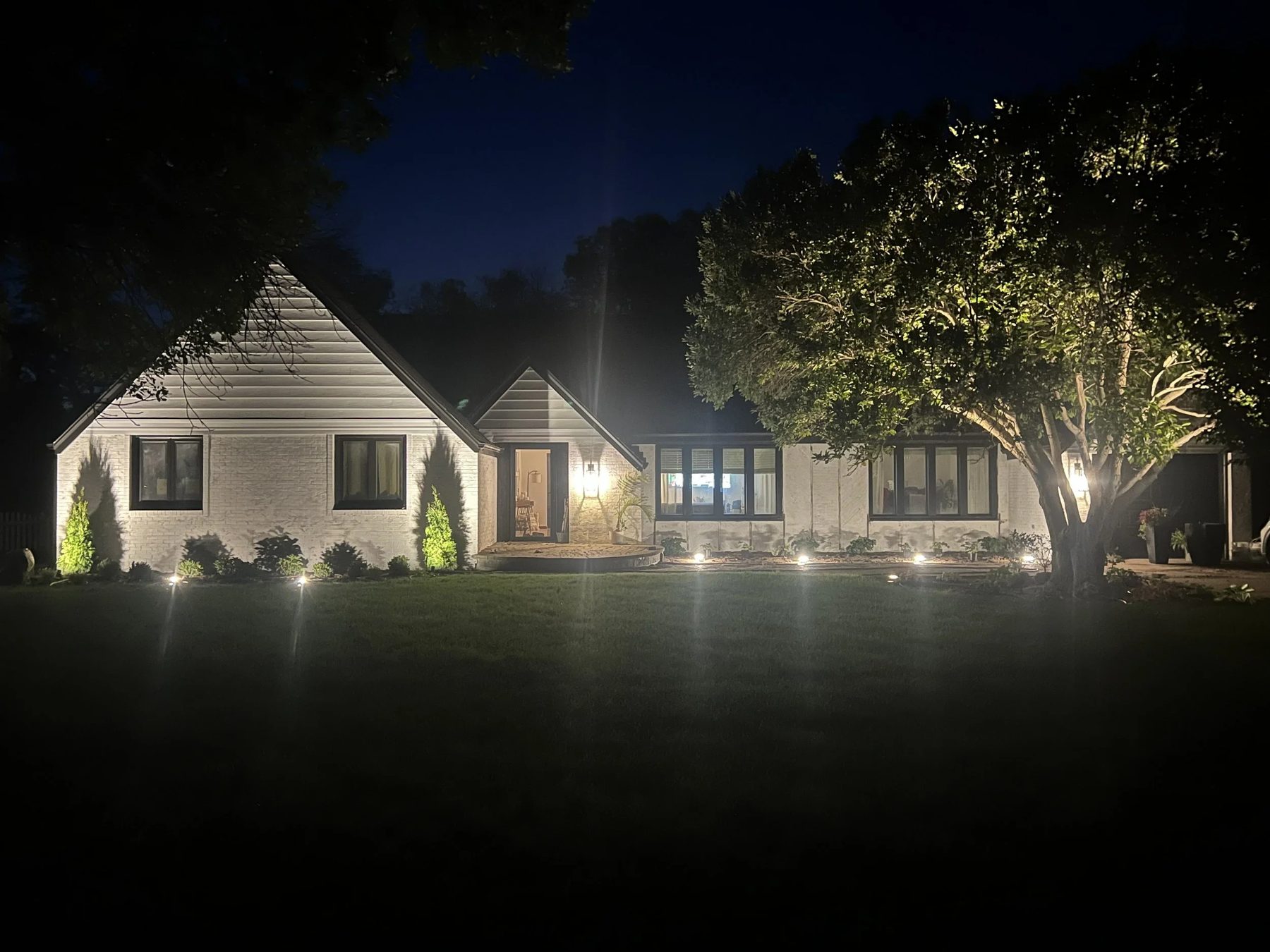 Evening landscape lighting on Aurora Nebraska home